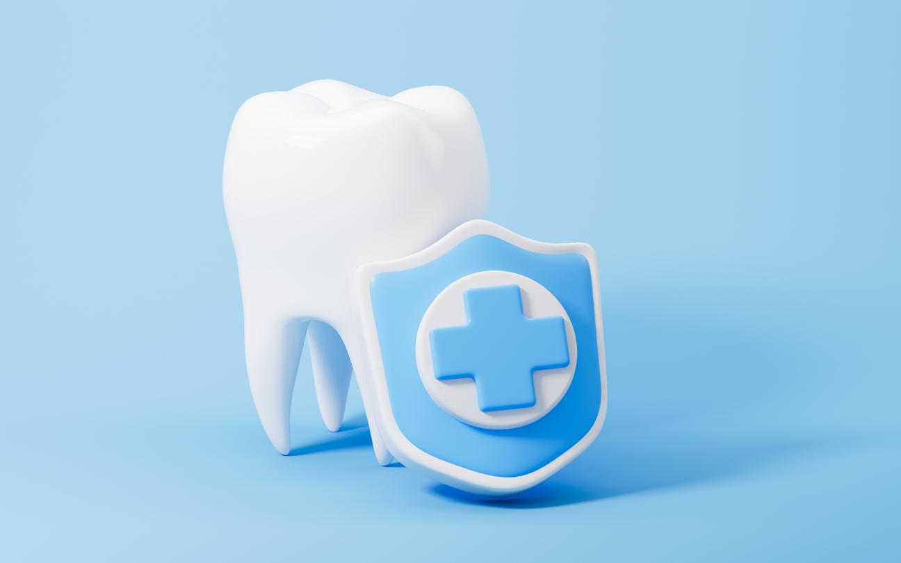 Model of a tooth beside a blue cross icon indicating emergency dental care